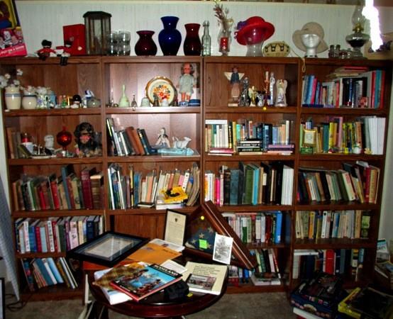 THE BOOK SHELVES MUST GO>>>Books, book shelves and all collectibles---vases, oil lamps, collection of angels, hand bells, hats, oil lamp, shadow box, ceramic knick-knacks--old games and box of 10 puzzles--