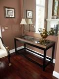 BLACK LACQUER CONSOLE TABLE WITH WOVEN/GLASS TOP.