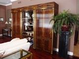 BAKER MASTERCRAFT 3 PC WALL UNIT - BAR, ARMOIRE WITH STORAGE AND CENTER LIGHTED DISPLAY CABINET WITH GLASS SHELVES AND DOORS - ALL WITH BRASS DETAIL.
