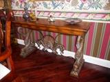 CONSOLE TABLE WITH CENTER SHELL DETAIL AD DOLPHIN BASES