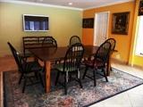 OAK FARM TABLE WITH 6 BLACK WINDSOR-BACK CHAIRS (2 ARM, 4 SIDE)