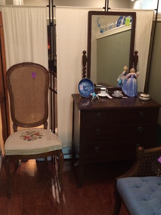 Sweet caned chair with needlepoint seat, small antique chest with swing mirror.