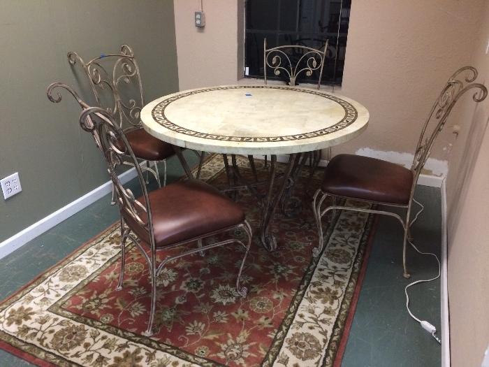 Wool rug with resin and wrought iron table and 5 chairs!