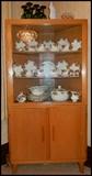 Mid-century Corner china cupboard.  Set of Royal Albert china. 