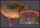 Carved round glass topped Asian coffee table.