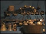 Antique sleigh and cow bells and brass bucket