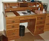 Desk
This measures 53 inches long by 24 inches deep by 42 inches tall. This has some damage on it. (MC24).