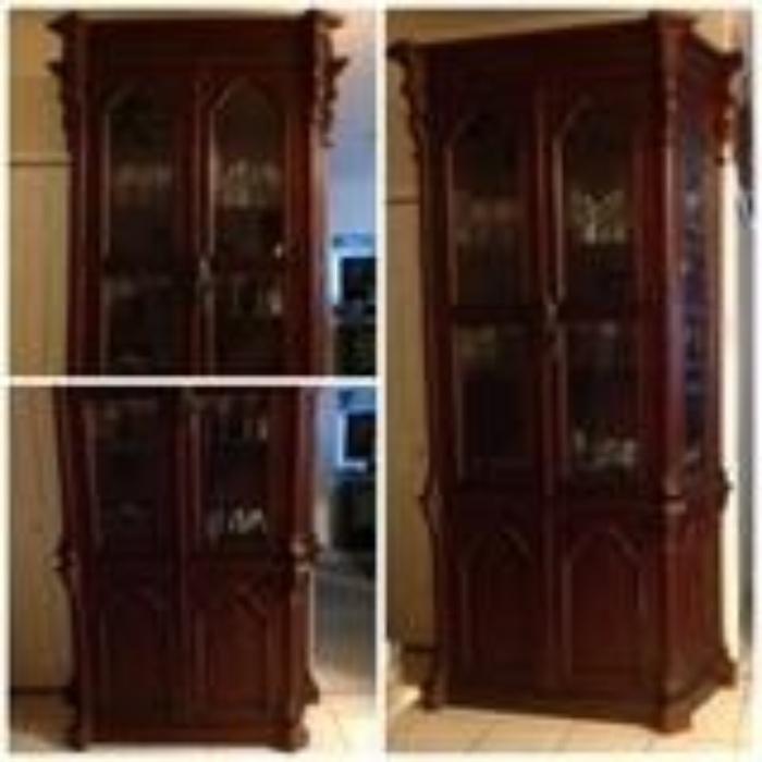 Solid Wood Cherry, glass doors on top, bottom wood doors with a concealed drawer.