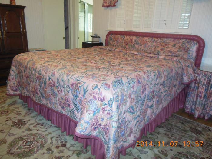 King Size Bed Complete with a Sealy mattress, frame, bed skirt, custom made bedspread, head board and valances.