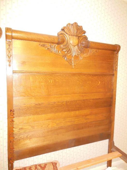 Vintage High Back, Oak (full size ) bed. Great carving on the head and foot boards, with wooden railings. 