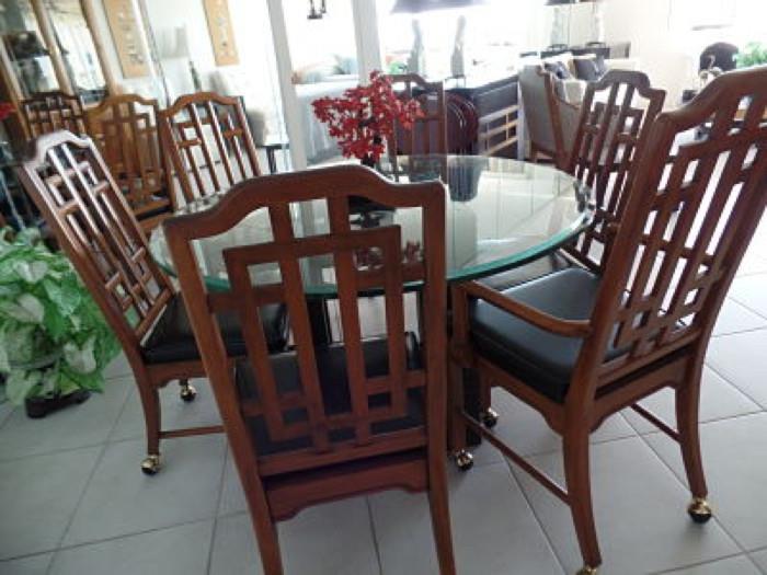 Asian style bevelled glass table with 6 chairs (2 with arms)