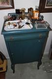 Sheet music storage cabinet. Large selection of perfumes.