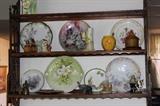 Plate shelf with bone china plates and knick knacks.