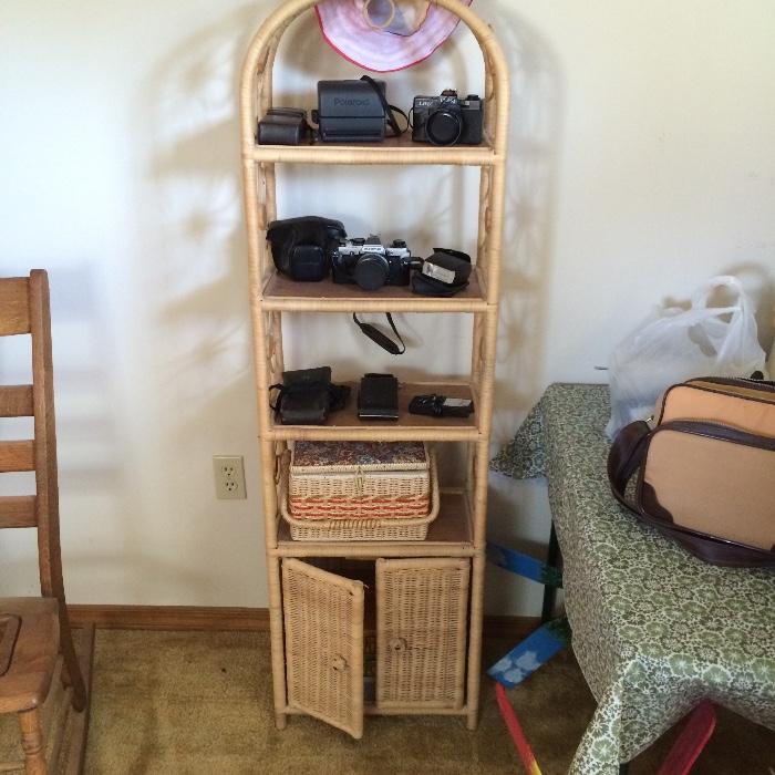 Wicker shelf unit, vintage cameras