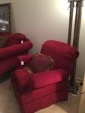 Red chair matches the custom sofa; large floor lamp