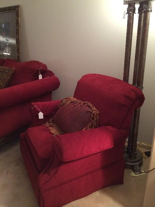 Red chair matches the custom sofa; large floor lamp