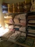 Many blankets, sheets, placemats, & other linens