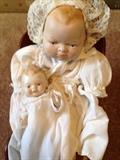 2 1930s made in Japan porcelain dolls and miniature doll cradle