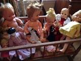1960s to modern dolls in a vintage wooden cradle