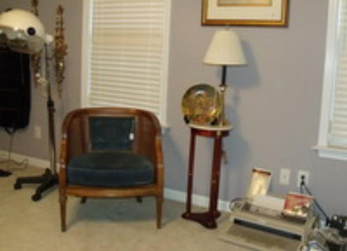 one of several chairs and small marble top tables, hair dryer on roll around stand
