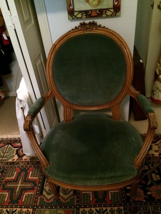          Single green velvet upholstered chair
