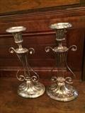         Unique pair of silver candle sticks
