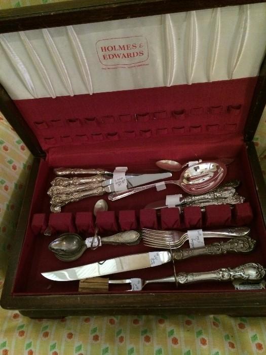   Many pieces of silver and silver plate flatware