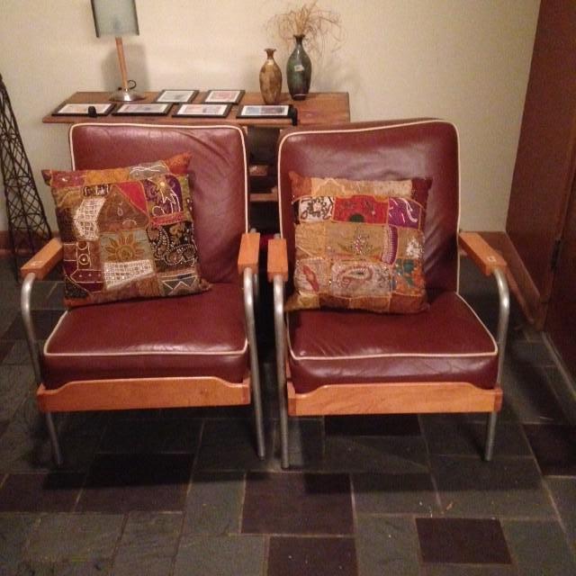 1940’s steel and wood club chairs with leather cushions. Hand made pillows out of Saris
