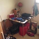 Camping equipment, fishing rods and vintage reels.