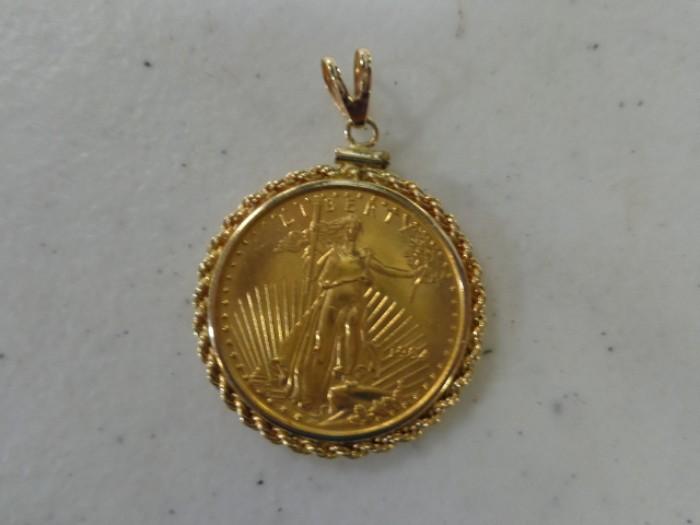 1994 $25 gold coin w/14 kt. gold bezel