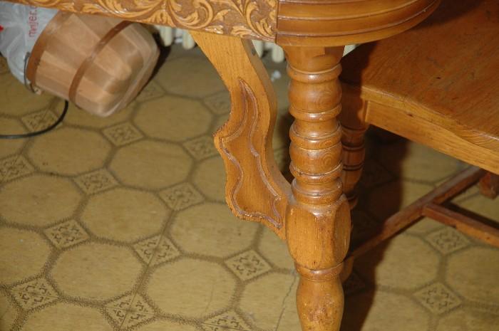Detail of carvings on wood table