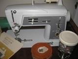 singer sewing machine with attachments and cabinet