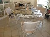 lovely white washed rattan dining room set with four chairs