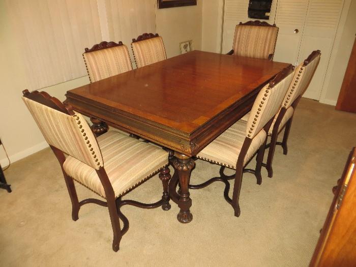 Matching antique dining room table and chairs