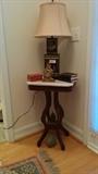 Victorian, marble-topped table with tin Asian lamp, vintage clock, fossilized floor bunny