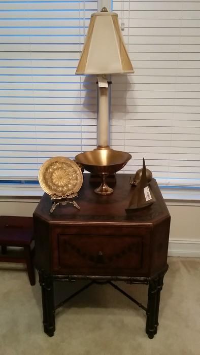 Very cool side table with cast iron base and faux leather tooling, Patina table lamp, I have no idea why this woman collected snails, but you'll see them throughout the house. Here's a pair of brass numbers, plus a sailboat and nice plate on stand. 