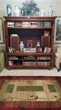 Nice wooden entertainment center by Romweber, quite heavy, two pieces, cheap, ugly rug, six Asian vases, decorative - not something you'll see evaluated on Antiques Roadshow.