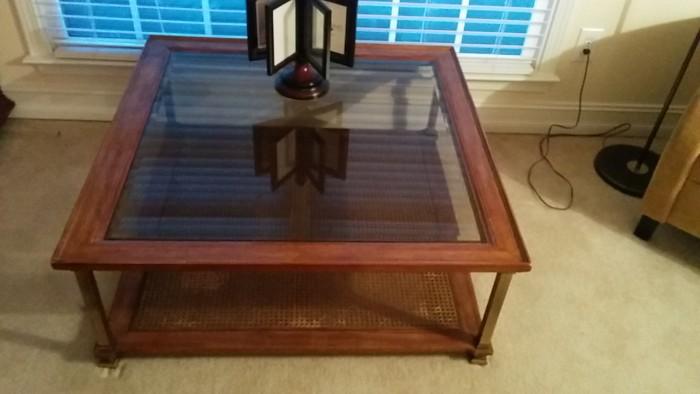 Frenchy mid-century beveled glass topped coffee table, with cane bottom