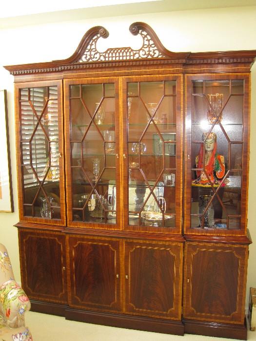 A superb Breakfront China Cabinet with Arch Pediment and banded satinwood inlay and flame Mahogany veneers  by Councill Craftsman.
