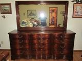 Vintage mahogany dresser with mirror ( Ignore the pile of linens in the background )