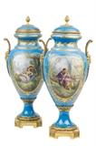 LOT 5: A PAIR OF FRENCH SEVRES STYLE GILT METAL MOUNTED PORCELAIN URNS