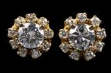 LOT 29: A PAIR OF 14 KARAT GOLD DIAMOND SOLITAIRE EARRINGS WITH DIAMOND JACKETS