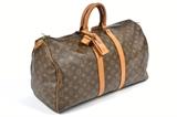 LOT 45: A LOUIS VUITTON MONOGRAM CANVAS KEEPALL TRAVEL BAG