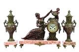 LOT 79: A FRENCH VINCENT & CIE PATINATED METAL AND MARBLE CLOCK GARNITURE