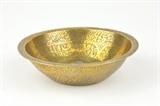 LOT 170: AN ISLAMIC BRASS MAGIC BOWL 