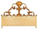 LOT 281: A FRENCH ROCOCO STYLE GILTWOOD HEADBOARD