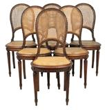 LOT 306: A SET OF SIX LOUIS XVI STYLE CANED CHAIRS