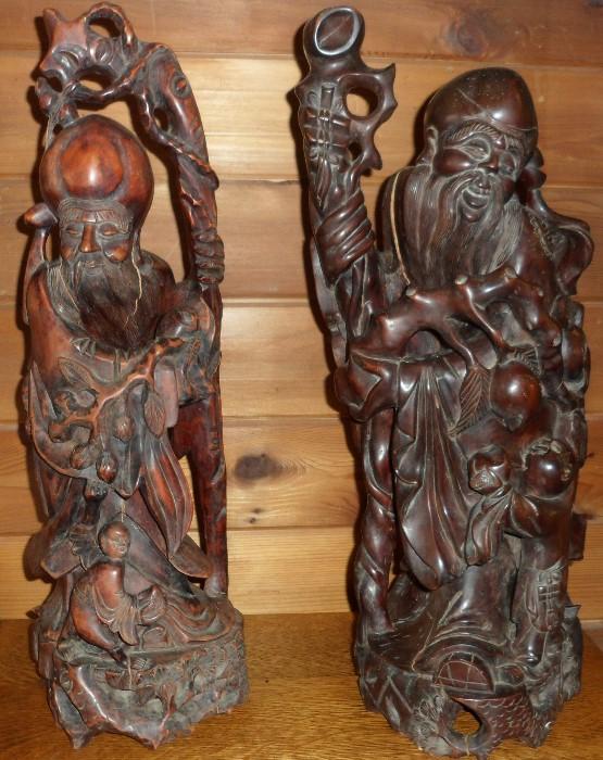 19th century pair of large rose wood "Immortals" statues (24").
