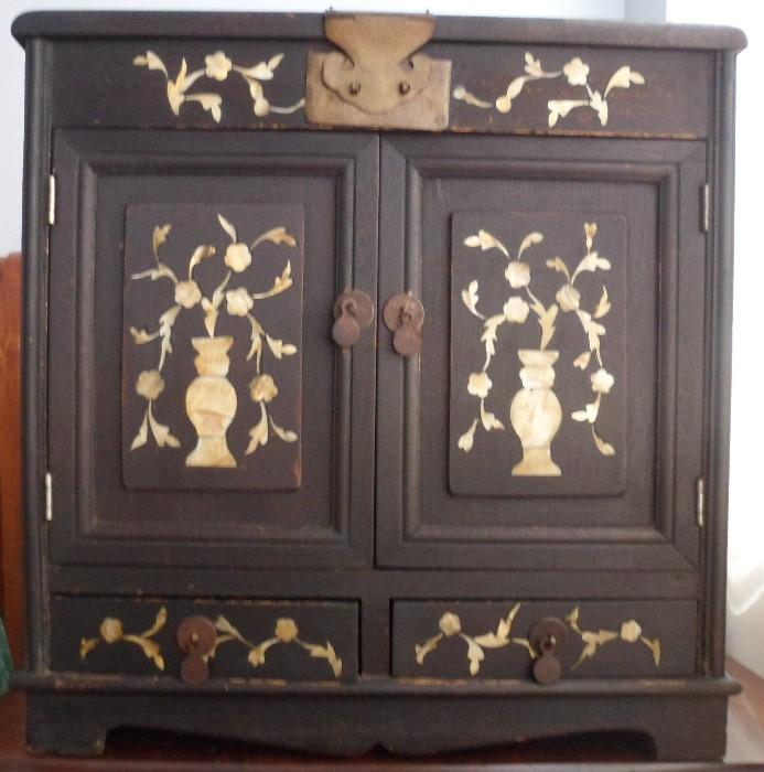Mother of pearl Chinese jewelry cabinet.