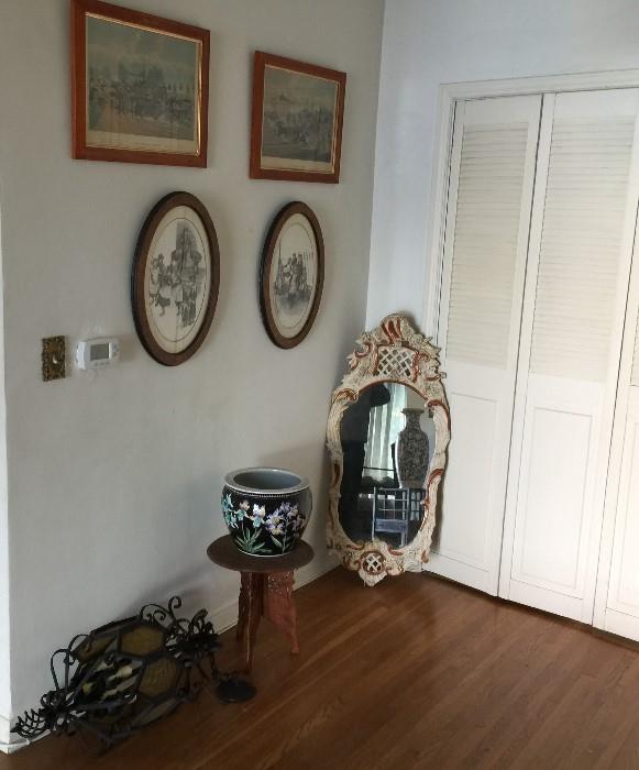 Two lithographs, wrought iron with glass heavy ceiling lamp, ghesso frame mirror.